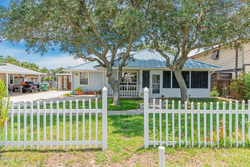 This property has sold! Discover similar listings by reaching out to us for an updated list of available properties that match your preferences. Just 1.5 blocks from the sugar-white sands and emerald waters that define Panama City Beach, this charming 3BR/2.5BA home blends coastal living with everyday comfort. Whether you're looking for a laid-back primary residence or a vacation getaway, this property offers flexibility, easy living, and a prime west-end location. Situated in a golf-cart friendly neighborhood with no HOA, you're just a short stroll or quick ride to the beach and local favorites like Thomas Donuts and Carousel Supermarket. What's more, it's only a short 10-minute drive to Pier Park or 30A, making it easy to enjoy everything the area has to offer. Inside, the home features a light and open living space with tray ceilings, tile and LVP flooring throughout the main areas, and carpeted bedrooms for added comfort. The large screened front porch invites you to unwind after a day in the sun, while a backyard gazebo offers a shaded space to relax or entertain. Behind the home, a 20x12 air-conditioned shed provides endless possibilities - use it as a workshop, home office, storage, or flex space. The home also features a Tesla Powerwall and fully paid-off solar panels, helping you significantly reduce monthly electric bills ($30-$40/month on average). Other highlights include a new metal roof (2022), HVAC replaced in recent years, and kitchen appliances installed in 2018. Well cared for and thoughtfully equipped, this beachside property makes coastal living both simple and stress-free. Reach out today for a private tour.