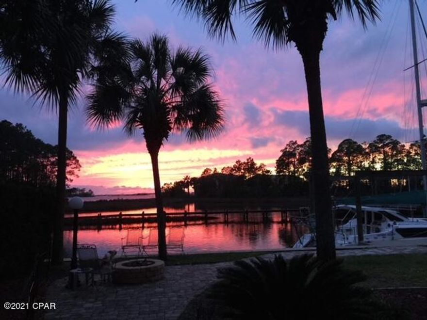 Immaculately kept waterfront, pool home with boat slip and tidal access to the bay. This contemporary 4 bedroom 3 full bath home is one you will want to call your own.   Home features a master on the main floor, an updated kitchen, eating area, and living room with unbelievable views of the waterfront, sunsets, and marine life.  Main floor also offers a separate front office, large laundry room, guest bedroom, and full second bath.  The upstairs is like new with new carpet, sheetrock, and paint and has barely been used since recently renovated.  Upstairs features 2 bedrooms with water views, and boasts a  third full bathroom.  Enjoy those gorgeous sunsets with family and friends from your enclosed pool and hot tub.  Home is beautifully landscaped with pavers, and a fire pit at the water. Additional features include  kitchen island with Jennaire convection down draft cooktop, a cozy, double see through fireplace  (gas and/or wood burning) to enjoy from the kitchen eating area and the living room, under counter wine cooler, two heat pumps, two water heaters, plenty of storage, and a separate irrigation meter.  Two outside storage sheds and semi circular driveway.  New roof in 2019 and newer windows and newer seawall and boat slip.  All appliances and pool equipment convey with sale. 

This home is a beauty you will not want to leave!!!

Curtains in the Living Room, Master Bedroom, and Guest Room upstairs (with bed) does not convey.  Also, outside potted plants and wind chimes do not convey. 

All information is reliable but not guaranteed.