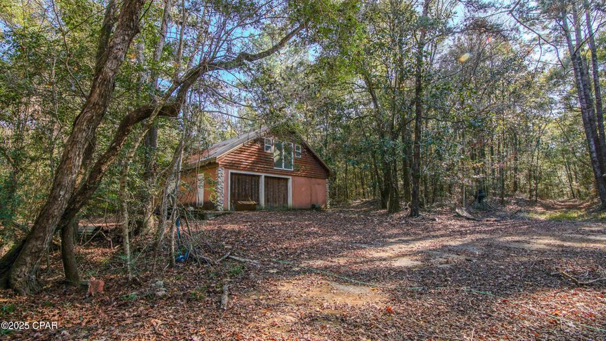 78 acres of prime North Walton County land offering space, privacy, and unmatched access. Located minutes from I-10, this property puts you within an hour of the Gulf beaches, a national airport, and Alabama—close to everything, yet completely removed when you're on site.

The land is level, solid, and highly usable, with established wide trails throughout for easy access by side-by-side, ATV, or truck. A substantial concrete building with asphalt parking provides secure storage for all your toys and equipment, featuring a large workshop/garage with a barn-door style sliding two-car garage opening—built for function and durability.

Wildlife is abundant, including deer, turkey, and boar, making this an excellent hunting and recreational property. Whether you're looking for a private retreat, a sportsman's paradise, or a long-term land investment, this is a rare opportunity to own a beautiful, versatile tract in a highly convenient North Florida location.