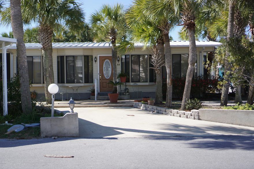 Amazing opportunity to own a beautiful Venture Out home on a corner lot!! Large living room and nice size kitchen. Large amount outdoor space make this property very unique.  Venture Out has 300' on the beautiful pristine beaches of the Gulf of Mexico and 1,000' on the Grand Lagoon. Venture Out has something for everyone. With two salt water pools (one heated), fishing pier, boat ramp, mini golf, children's play ground and much more.