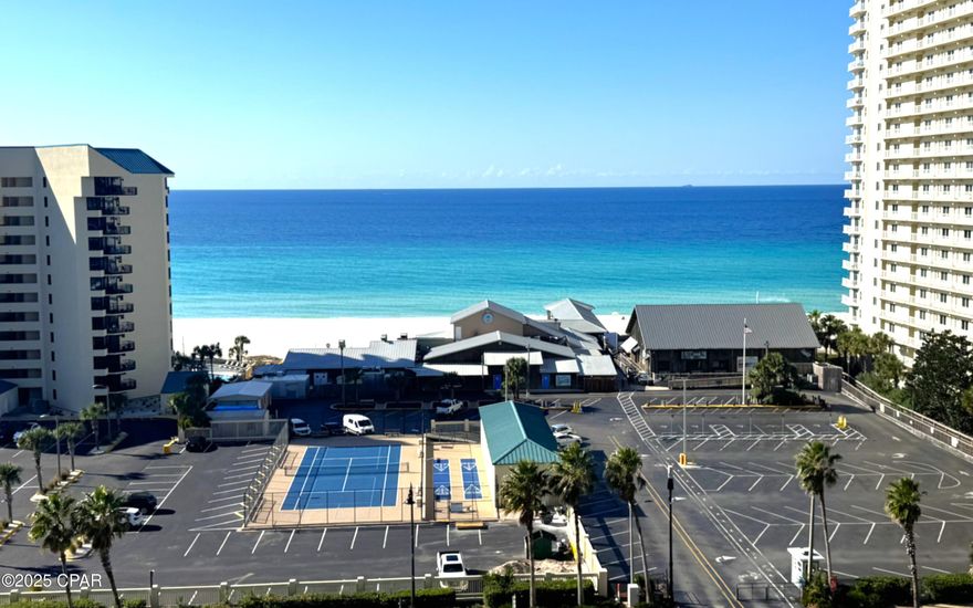 **PRICE REDUCTION**Spectacular Gulf-Front Condo at Laketown Wharf Resort
Step into a premier resort lifestyle with this beautifully maintained, TURN-KEY, 2-bedroom, 2-bath unit w/ bunk room (approx. 1,262 sf) located on the 9th floor of Laketown Wharf Resort in Panama City Beach. This condo features designer finishes, luxury vinyl plank flooring, updated light fixtures, stylish ceiling fans and barn door to the bunk room. Enjoy sweeping Gulf views from your private, large balcony—perfect for sunrise coffee or sunset cocktails.  Relax or entertain in the spacious living/dining area with an open kitchen layout featuring modern appliances and a kitchen island. The generous master suite boasts an en-suite bath and ample closet space.  Beyond the unit, you'll enjoy resort-style amenities including five shimmering pools, two hot tubs, tennis courts, pickle ball, 24-hour security, covered parking, nightly light show, on-site restaurants and — all steps from the beach. The new bowling and billiards, located on the first floor of the parking deck, also gives you a rainy-day option.  It's great for date night, watching football or just letting the kids blow off some energy. Whether you're looking for a second home, vacation rental investment or full-time residence, this condo is a rare opportunity. ***$2500 lender credit available with Tim McConnell with Allegiant Lending. Schedule your viewing today — opportunities like this don't last long!