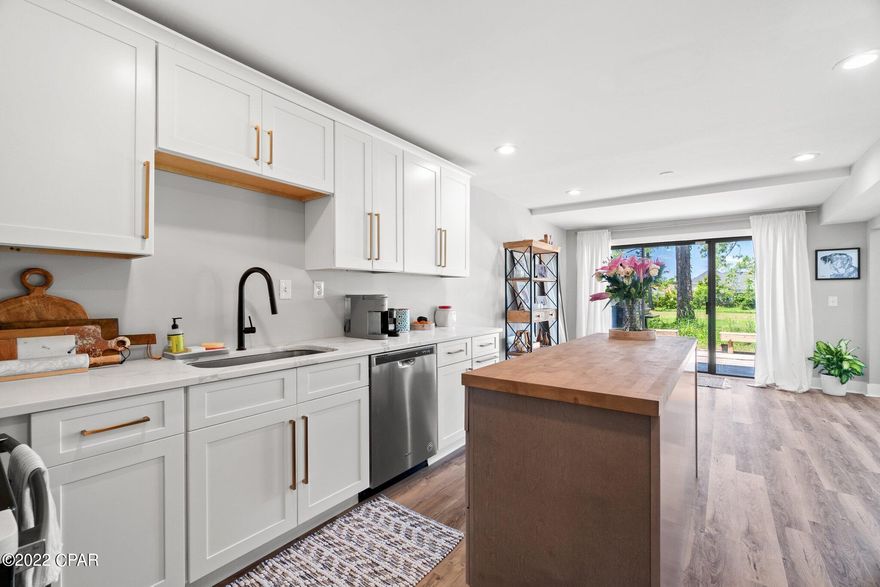 Newly renovated 2 bedroom, 2.5 bathroom Golf Villas I condo within the gates of Bay Point community! This unit features the two-story townhouse configuration, which means nobody above or below you! Unit was remodeled in 2019 with upgrades that include: vinyl plank flooring, shaker soft close cabinets, stainless appliances, quartz countertops, recessed lighting. First floor includes living room, dining room and kitchen. You can exit out either of the rear sliding glass doors to a wood deck that expands the length of the unit. Second floor includes the master bedroom with on-suite master bathroom and walk-in closet.  Second floor also includes additional bedroom with full bathroom and a large storage/bonus room that has many uses. Bay Point community has new board personnel with exciting things in the works, beautification projects, new marina, new developments with commercial opportunities and more!