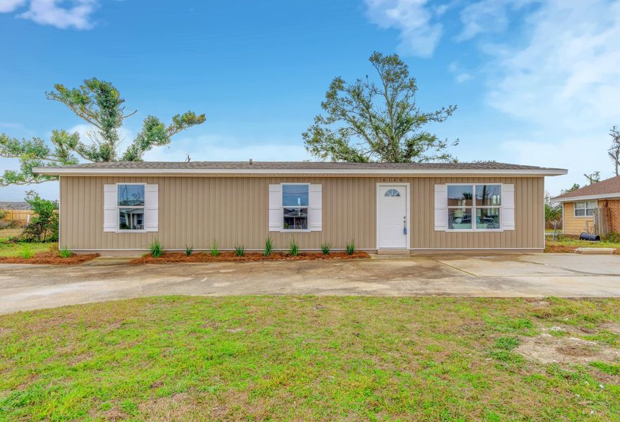 THIS GORGEOUS HOME WILL NOT LAST LONG!  This fully renovated 3 bedroom, 2 bathroom home features an open floor plan and many tasteful updates. The kitchen is extraordinary, featuring a large kitchen island with a built in stove/oven combo &  a range overhead, new soft close drawers/cabinets with granite countertops, a massive pantry with access on either side of the refrigerator and new stainless steel appliances. The spacious living space off of the kitchen could used for an additional living room or bonus room. The homes features new LVP flooring throughout the entire home, light fixtures and fans throughout the home, New bathroom vanities, mirrors, fixtures and toilets, and New windows throughout. NEW ROOF. The recently manicured landscaping adds great curb appeal.