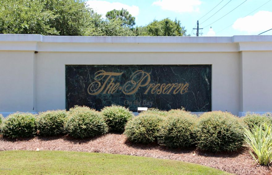 Beautiful corner lot with extra high elevation! The Preserve On The Bay is bay front community loaded with grand oak trees, magnolia trees and beautiful vegetation. It Is gated community with 24 hour security conveniently located near the Beaches, Shopping, Bay Point Gulf Course and Marina!