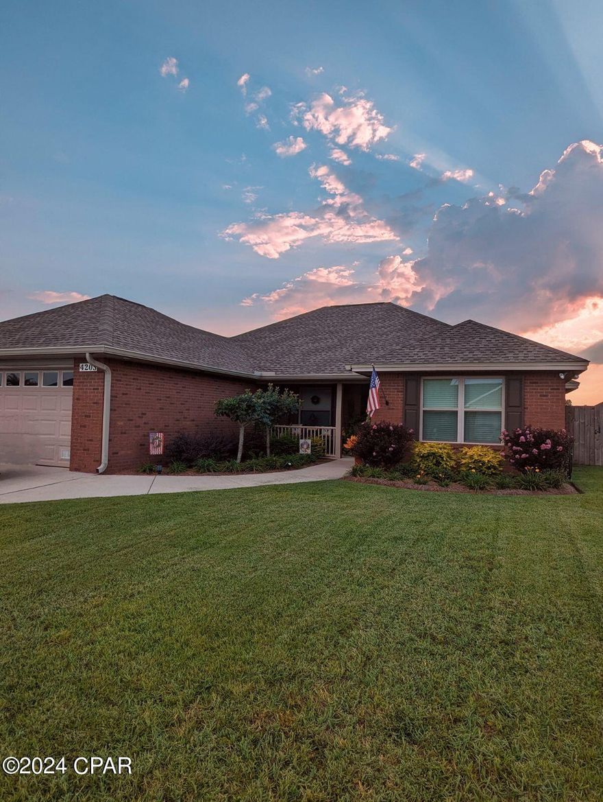 'CURRENTLY UNDER CONTRACT, SELLER WILL CONSIDER BACKUP OFFERS. 
Seller is included a generator that will hook to the pre—wired generator connection so you don't lose power in case of a storm and the hot tub will convey as well with an accepted offer.  Bring your buyer by to see this immaculately kept home today!  

The home features four spacious bedrooms, two bathrooms, a practical split floor plan, and a kitchen with stainless steel appliances, a cozy breakfast bar, and a dining room that seamlessly connects to the kitchen. The expansive living room has a charming corner fireplace, and there's a delightful heated and cooled sunroom-Florida room just off the living room.  Leave the french doors open and this room is a beautiful expansion of the living room or close it off for an additional space all its own.  

The backyard is an oasis with exquisite landscaping, a 168 sq ft covered patio area, a 220 sq ft screened porch, and an additional concrete pad that has served as a the perfect home for the spa!

For added security and convenience, the home is equipped with a security system, generator that can be hooked directly into the electrical panel, and an outdoor shower under the covered patio.

The home has proven its resilience during challenging weather conditions, and the roof and carpeting have been replaced by insurance, ensuring the property's excellent condition.  You will not find a home in any better condition than this one, it has been meticulously maintained and that shows.  Call and schedule an appointment to see this amazing home today.