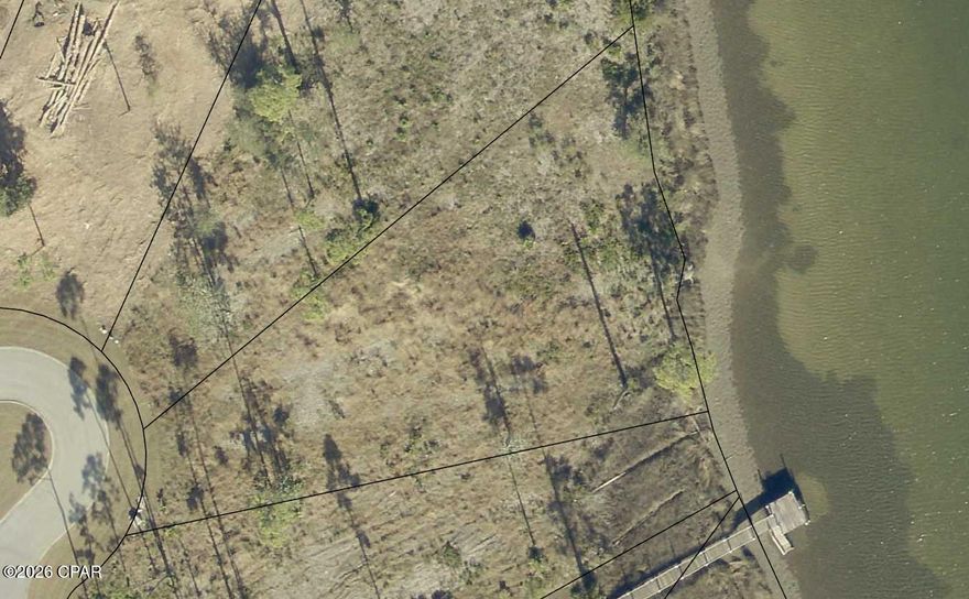 Remarkable waterfront lot in the gated neighborhood of Laird Point. Laird Point is a quiet gated coastal community set on a peninsula with breathtaking views of East Bay, which leads to the Gulf of Mexico. This lot has 161' of deep water frontage: minimal wire grass and one of the few deeded dockable lots. This property has a 1600sf transferable dock permit that has HOA approval. Lot 39 is a prized location for a resident wanting an Eastern-facing water view. Geotechnical Report describing foundation options available upon request. Close to the social attractions of nearby Panama City and Tyndall Air Force Base. New homes are being built in the neighborhood now.