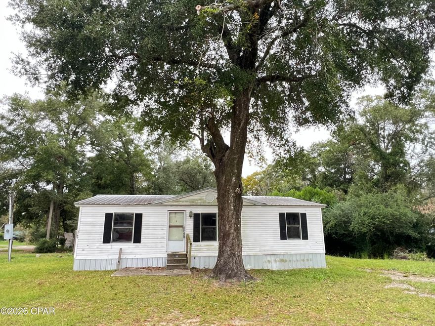 Owner Financing available with 50% down. This property features 3 Mobile homes being a 1993 - 3 bed/2 bath Doublewide, 1990 - 2 bed/1.5 bath singlewide, and 1974 3 bed/1 bath singlewide. All roofs are solid with no leaks. One home can be move-in / rent ready with minimal repairs and the remaining homes do need more work, however once completed these homes could bring in over $3,000 in rental income a month. These homes are located 45 minutes North of Panama City Beach with the direct area seeing major growth and improvements including new paved streets, 4 lane highway expansion, and new development of a golf resort in Vernon growing the local rent demand. The homes are on city water with septic. Property is being sold as-is with no repairs. Buyer to verify all details regarding the property, subdividing parcels, zoning, and square footage.