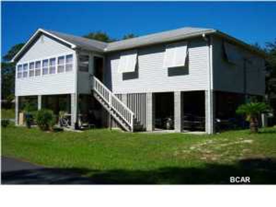 Wonderful 3 bedroom 2 bath home on corner lot one block from South Lagoon, Convenient to the Dolphin St. boat launch and the Gulf and sugar sand beaches. This home is well maintained, with a huge enclosed sundeck and work shop not included in the Sq. Ft. Laundry room off kitchen and includes washer/dryer as well as all kitchen appliances. The large Master Bedroom has a walk in closet, and plenty of room.This home has double paned windows and hurricane shutters. Call today for an Appt. to view. All measurements are approx. Buyer to verify if important. DON'T MISS OUT ON THE BEST OPPORTUNITY AT THE BEACH! Call for your appt. today.