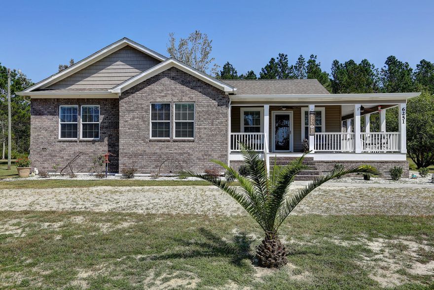 CURRENTLY UNDER CONTRACT, SELLER ACCEPTING BACKUP OFFERS. If tranquil country living is the life for you then this home will fit the bill. The location is serene with 2 acres and only 2 miles to the nearest boat slip at Howard Creek Park. Enjoy fishing in Howard Creek or boat into the Apalachicola River or just a bit further to the Gulf of Mexico. The wrap around front porch invites you into the open floor plan with beautiful teak hardwood floors throughout and architectural corners. The living room is open to the kitchen and dining area and features builtin shelving with an office space. Centering the kitchen is a custom vent hood off set with ribbed glass cabinets. The kitchen features an abundance of cabinets with a working island and breakfast bar/buffet.  Other features are beautiful stainless steel appliances including builtin microwave and new Bosch dishwasher. The breakfast area is inviting with lots of natural light and access to the wrap around porch. The split bedroom plan lends added privacy to the master suite. The over-sized master bath features tile floors, multiple drawers with built-ins, double vanities, makeup station, separate shower, jetted tub and more. The two additional bedrooms and guest bath are easily accessed from the living area. The backyard outdoor living space has a screened gazebo and a patio area for entertaining. The two car garage with beautiful stained doors includes work benches, shelving and finished floors in the attic space for additional storage. There is also a separate yard shed for your lawn mower and yard tools. Other features include beautifully stained 5 panels doors throughout the home,  walk in closet in one guest bedroom, a Salt and Carbon Water filtration system, Trex decking on the porch, store doors, and extra insulation for lower electric bills. With so many extras to offer this could be the house for you.