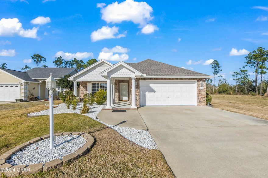 PERFECTLY PRISTINE 3/2 HOME IN A FABULOUS LOCATION with access to beautiful Lake Marin! You won't want to miss this beautifully appointed home with tons of updates!  This community is hidden right in the middle of town. County zoned, so you don't pay the higher tax rates of Panama City and Lynn Haven, but 3 minutes to Mosley High School! There is an easement where all home owners may access Lake Marin for fishing, kayaking, canoeing, etc. The kit has gorgeous custom cabinets with pull out shelving. Lots of storage under the breakfast bar, plus a pantry.  Updates include new carpet, oven, cooktop, microwave, fridge,
dishwasher and so much more. Full list in document section of MLS. Home has shallow well for irrigation, insulated garage door. Entire home, inside and out has been painted.  HOA mows and fertilizes the lawn! What's not to love?!  Text to show!  Age, sq ft, rm sizes, lot size are estimates. Please measure if concerned.