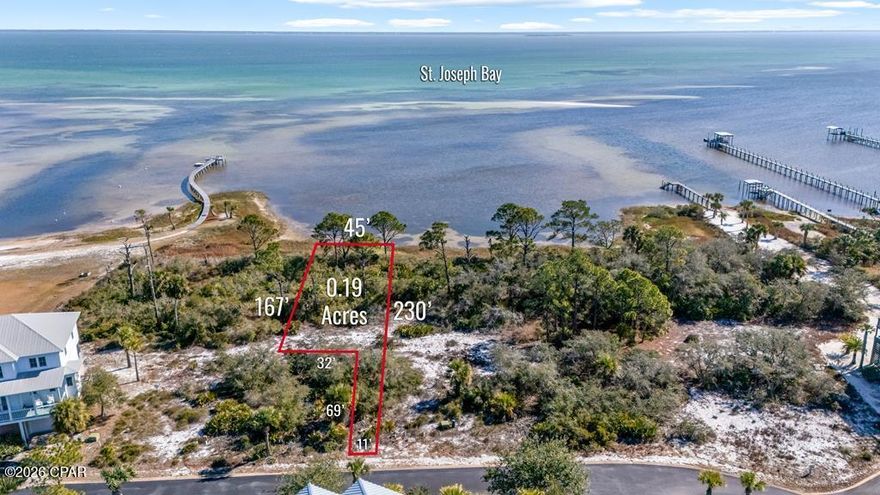 BAY FRONT NORTH CAPE SAN BLAS HOMESITE, in Ovation - one of the area's most prestigious gated communities. Perfectly positioned along the tranquil waters of St. Joseph Bay, offering sweeping views, unforgettable sunrises, and a lifestyle that blends refined coastal elegance with natural beauty. This exceptional bay-to-gulf neighborhood stretches from the sugar-white sands of the Gulf to the calm Bay waters, providing exclusive access to both. Ovation offers an unmatched collection of resort-style amenities. The Bay Club features an infinity-edge pool, fitness center, hot tub, fire pits, and scenic day docks overlooking St. Joe Bay ideal for boating, kayaking, or simply unwinding by the water. Tennis and pickleball courts, and inviting gathering areas enhance the community's relaxed yet upscale atmosphere. On the Gulf side, residents enjoy a second pool and bathhouse with private boardwalks leading directly to miles of pristine beach where you can watch the sun set. Meticulously maintained landscaping and a minimum build requirement of 2,000 square feet ensure a cohesive and elevated neighborhood feel. Conveniently located near St. Joseph Peninsula State Park, home to the named #1 Beach in America, for miles of pristine shoreline, nature trails, and outdoor adventure. This homesite presents a opportunity to build between the Gulf and the Bay along Florida's Forgotten Coast. No timeline to build.