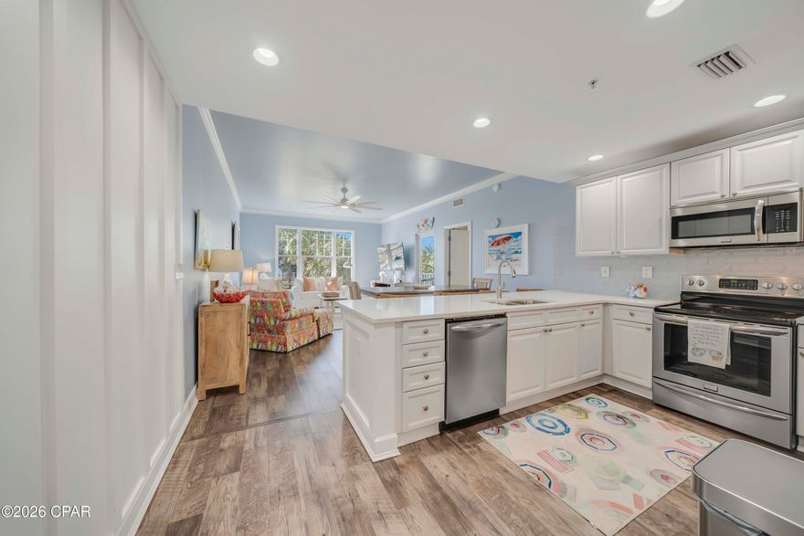 Wow - gorgeous from the moment you open the door!  Experience lagoon-front living in this stunning 2-bedroom, 2-bath coastal residence located in the highly desirable Bay Point community. Your condominium features a fully updated kitchen, new luxury vinyl plank flooring throughout, a brand-new HVAC system, open-concept layout, and elegant board-and-batten wood trim details. Step onto your private balcony—ideal for relaxing or entertaining—while taking in spectacular water views and unforgettable sunsets. Reflections at Bay Point offers breathtaking lagoon and St. Andrew's Bay views along with resort-style amenities including a lagoon pool, heated pool, hot tub, fire pits, outdoor grilling areas, and an owners' lounge.  Residents also enjoy access to Bay Points Nicklaus-designed golf course, Point South Marina, and waterfront dining just steps away.  Ideally located near St. Andrews State Park and the desirable east end, you can take advantage of opportunities for boating, fishing, shopping, dining, and all the attractions Panama City Beach has to offer. Whether you're searching for a primary residence, second home, or vacation rental opportunity, this property checks all the boxes. Schedule your private showing today!