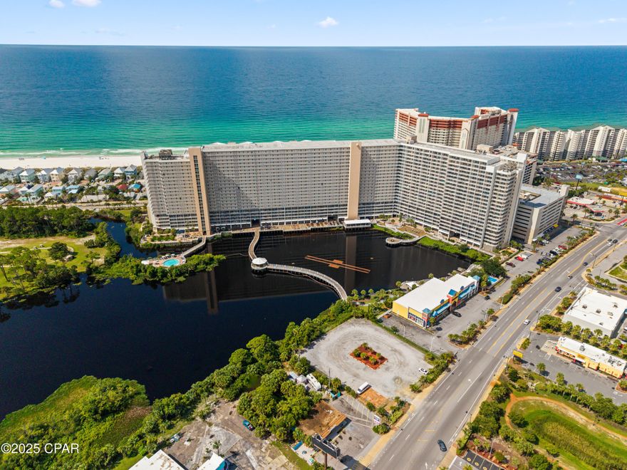 Step into coastal comfort with this stylish one-bedroom, two-bath condo featuring a bonus bunk area and an open, inviting layout. Thoughtfully updated and fully furnished, the unit offers a welcoming kitchen island perfect for gathering, and a private balcony with peaceful lake and fountain views.Conveniently located near the elevators for easy access, this condo has earned over 50 five-star reviews in the past year alone, with no ratings below five stars. Previously managed through Evolve, it now thrives exclusively on Airbnb, showcasing its strong rental performance and guest satisfaction. Laketown Wharf delivers resort-style amenities including five pools (one heated), two oversized hot tubs, a kiddie pool, a putting green, and a Gulf-view fitness center. Direct beach access is just across the street, with popular dining spots like Pineapple Willy's only steps away. Thanks to its unbeatable location, proven rental success, and access to premium amenities, this condo presents an exceptional opportunity for both vacation enjoyment and smart investment.