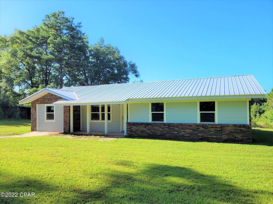3-Bedroom, 2-Bath Brick and Vinyl Home that has undergone a complete renovation. Nice quite country setting with no visible neighbors. Located just outside of Graceville, FL on 7.75 ACRES with paved road frontage.  The huge kitchen has new cabinets, new granite countertops, and a breakfast bar.  Large separate dining room with a bay window overlooking the back yard. Large master suite comes with it's own attached bathroom. Garage was enclosed and could make a 4th bedroom or office. Large laundry room with new tile floors.  Fresh paint throughout, vinyl plank flooring, new roof in 2020 with spray-foam insulation, and new HVAC in December 2020.  Has an attached carport , a concrete driveway, and a pole barn. Seller will sell the home, 2 acres, and survey for $250,000.00.