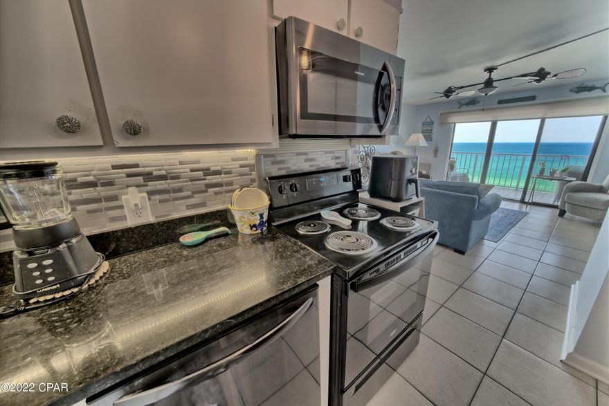 CURRENTLY UNDER CONTRACT, SELLER WILL CONSIDER BACKUP OFFERS. Beachy Gulf Front Condo featuring a colorful Sea Life Mural with Bead Board /Chair Rail. Large Bedroom will accommodate 2 queen beds or one King Bed with a small Daybed if desired.  Built-in Bunk beds in the hallway with electrical outlets for TVs, devices, etc. The bathrooms have updated vanities, Quartz countertops and updated fixtures. Unit comes with washer/dryer hook-ups. Kitchen includes updated appliances, newer base cabinets with Quartz countertops and Large Deep Sink with disposal. HVAC has been well maintained. Water Heater replaced in 2021. Nice Solar Shade helps keep the Living Room cool in the afternoon sun. Conveniently located near the Elevators. FANTASTIC RENTAL!The Summit is a popular family destination with 2 pools (one heated), Kiddie Pool, Hot Tubs, Tiki Bar, Game Room, Basketball and Tennis courts. Gated community with on-site security.