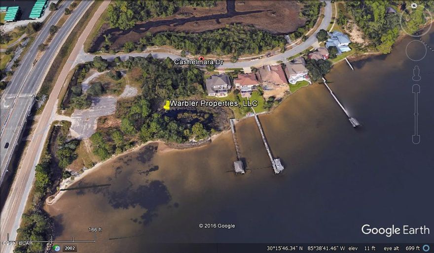 Build your dream home with Gulf access-Enjoy the relaxation of waterfront living as you watch and enjoy the dolphins frolicking in the water just off your property.