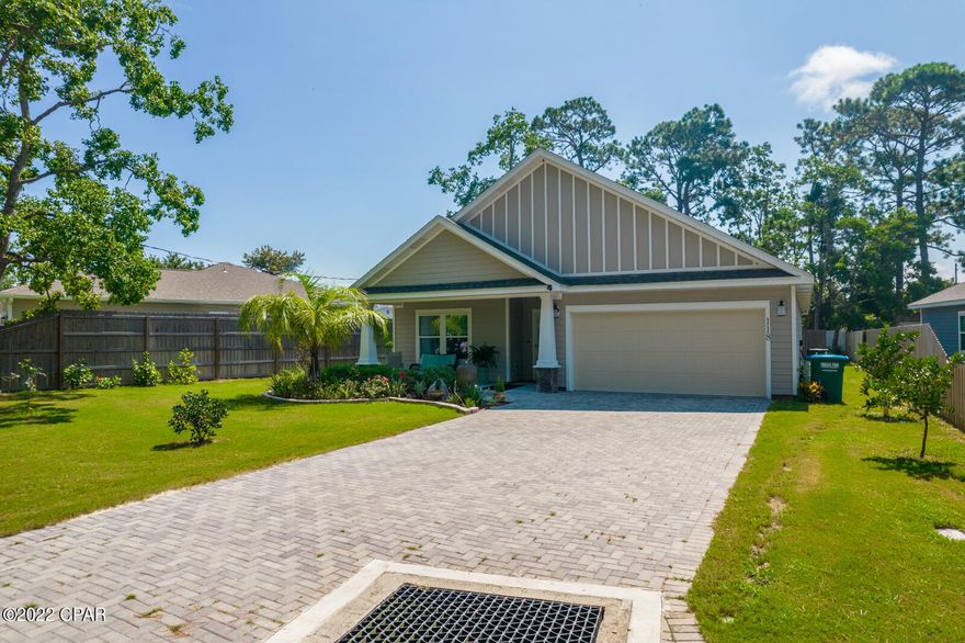 Elegant craftsman-style home less than 2 years old. This home was built with custom accents and attention to every detail. Modern open floor plan concept. Quartz countertops, stainless-steel appliance package includes; 5 burner range, dishwasher, refrigerator, and built-in microwave. Kitchen includes shaker style, soft close cabinets, tiled backsplash. Master bath features a double vanity, contemporary tiled shower and a walk-in closet. The 2 additional bedrooms share a full bath that opens into a hallway for guests. Master suite and living room feature tray ceilings. Modern wood like tile throughout. Low E-Energy saving window package. Driveway constructed with pavers. Upgraded lighting package. Energy efficient insulation throughout the home for your energy savings. Fully landscaped with sprinkler system. 1 mile to the white sandy beaches of the Gulf of Mexico and minutes to the dining and attractions of Pier Park and 30A. Measurements all approx. if important please verify.