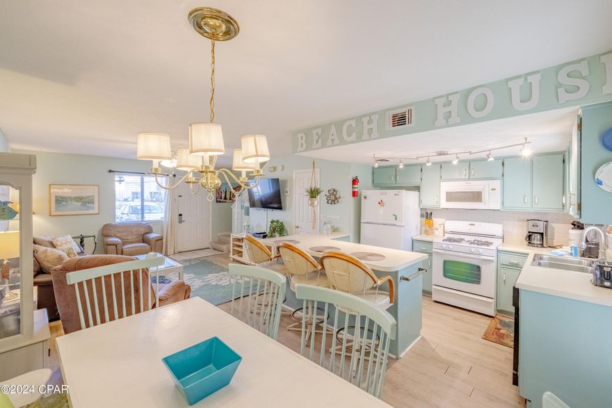 CURRENTLY UNDER CONTRACT, SELLER WILL CONSIDER BACKUP OFFERS  Discover your dream escape in this enchanting 2-bedroom, 1.5-bath townhome, a perfect fusion of comfort and elegance for a primary residence, vacation haven, or a savvy investment opportunity. Nestled in the heart of the vibrant Gulf Highlands Beach Resort, this residence is a stone's throw from the pristine sugar white beach, offering an exclusive retreat between two of the eleven sparkling community pools. Imagine mornings watching sunrise over the ocean and evenings strolling along the soft sands, all just steps from your door.

Step inside to find a fully furnished sanctuary, where every detail is curated for your utmost comfort. The townhome boasts recent upgrades, ensuring a seamless blend of modern luxury and timeless charm. From the 2023 water heater and plumbing enhancements to the freshly painted exterior in 2020 and stylish LVP flooring laid in 2019, each element has been meticulously selected for quality and style.

Positioned ideally across from a lush park/playground and tennis courts, your new home offers endless opportunities for recreation and relaxation. Two reserved parking spaces provide the utmost convenience, right at your front door.

Beyond the walls of this exquisite townhome lies the gated Gulf Highlands Beach Resort, a community celebrated for its golf cart-friendly paths, extensive amenities, and vibrant atmosphere. Indulge in the exclusive beach access, lounge by the beachside clubhouse and pool, or dine at The Beach House Restaurant. Engage in friendly competition at the shuffleboard courts, four tennis courts, or the 18-hole mini-golf course, and stay active with the gym facilities.

Embrace the blend of tranquility and excitement in this coveted Panama City Beach location, surrounded by top-tier restaurants, shopping, and the World's Most Beautiful Beaches. This is more than a home; it's a lifestyle waiting to be lived. Welcome to your extraordinary coastal retreat!