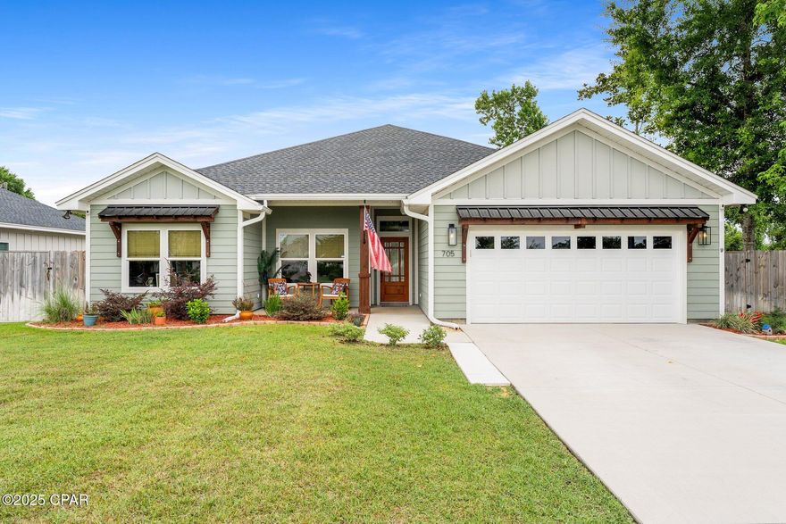 Modern Luxury in the Heart of Lynn Haven - 
Welcome to 705 Alabama Ave, a stunning 4-bedroom, 2.5-bath home crafted in 2023 by one of the area's most respected local builders known for quality and luxury finishes. Located in a rare no-flood zone this home offers both peace of mind and exceptional design.
Step inside to discover luxury vinyl plank flooring throughout, granite countertops, and extra tall ceilings with elegant tray accents that create an open, airy feel. The thoughtfully designed split floor plan offers privacy for the primary suite while keeping the additional bedrooms and guest bath tucked away.
The spacious layout includes a family-style dining room perfect for hosting holidays, dinner parties, or game nights. The heart of the home opens up to a large screened-in lanai with recessed lighting and outdoor fans—a true entertainer's dream.
The epoxy-finished 2-car garage adds a polished touch, while thoughtful details like window treatments and soffit outlets for Christmas lights (controlled by an interior switch) highlight the home's custom craftsmanship. Smart irrigation with rain sensing smart technology ensures your lawn is taken care of with the easy of phone app management. Smart home Thermostat makes temperature management a breeze. 
Enjoy the huge backyard, ideal for pets, play, or even a future pool. Set in a quiet, friendly neighborhood, this home truly has it all.
Don't miss your chance to own one of Lynn Haven's most beautifully designed homes—schedule your private tour today!