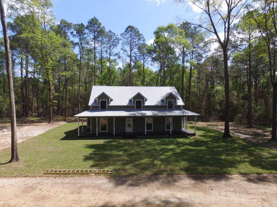 Absolutely amazing home sitting on 4.5 acres located less than a 1/4 mile from Lake Seminole boat landing. Home has three bedrooms, two and a half baths with 3,159 heated and cooled and 3,639 under roof. This home has been remodeled with high end materials for someone with exquisite taste. Large wrap around porch. Some of the upgrades include engineered hardwood floors, porcelain tile, granite counter tops, new whirlpool stainless steel appliances with a five eye cook-top stove.  Master is on the first floor and has a private entrance. Master bath has a tiled walk-in shower, two shower heads and three built-ins. There is a beautiful claw foot tub with dimmer lights.  Upstairs has FOUR additional storage areas.  New fixtures thru-out home. I cannot express how amazing this home is