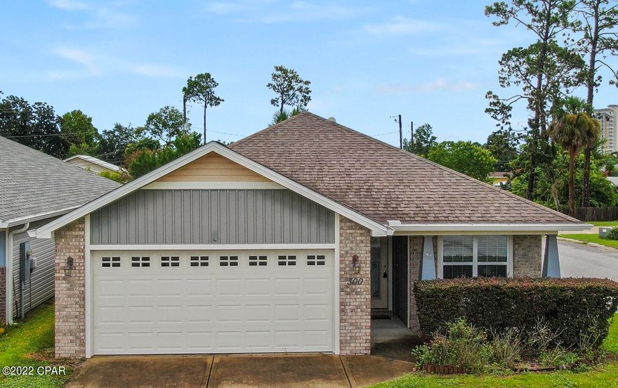 CURRENTLY UNDER CONTRACT, SELLER WILL CONSIDER BACKUP OFFERS. Located in a quiet neighborhood conveniently located to both Panama City Beach or Panama City. The adorable home was built in 2014 in Woodlawn Village. The cozy three bedroom, two bathroom home, 2 car garage is located on the east end of PCB. The adorable home was built in 2014 in Woodlawn Village on a Corner lot, extra parking area, SimpliSafe security system already wired to all windows, Walk in tub in master bathroom,  privacy fence in backyard