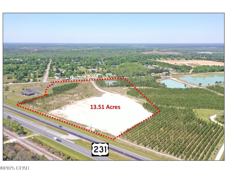 13.5 acres zoned General Commercial (GC-3) in unincorporated Bay County. The site was cleared and filled, which is a massive expense in today's market. The site is ideal for many commercial uses.  The median-cut on U.S. Highway 231 is centered on the 13.5 acre parcel. 1,087 feet of frontage on U.S. Highway 231. 763 feet of frontage on Hudson Road. The seller will consider leasing or selling the adjacent office building and property to the south. The 4,624 square foot office building is in pristine condition with superior construction on 2.91 acres. Please call listing agent for showing information. The survey is attached. Call for details and to setup a tour of the property.