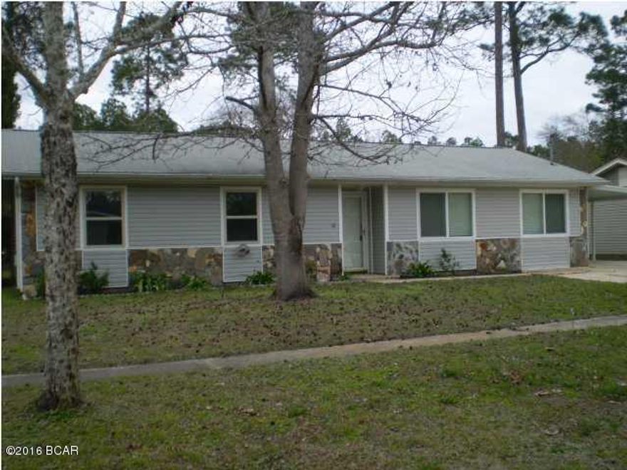 Come Home! Beautiful, Open Floor Plan, Move In Ready! Located in a  Family Friendly Neighborhood in LYNN HAVEN!!  This Home Has It All!  Beautiful Kitchen with matching Movable Island/Breakfast Bar; very nice Matching Appliances; Ceramic Tile Floors throughout, Painted with  Warm and neutral colors, with extra paint in hall closet. 3 Large Bedrooms, Huge Laundry Room, with lots of storage, Plus A Gas TANKLESS Hot Water Heater!! Screened in Back Porch, Covered Parking, Huge fenced in back yard PLUS a Large Aluminum storage building. You Just can't beat this price and location.  This family has taken great care of this home including annual cleaning/servicing of the HVAC keeping it in top notch working order. The Family has grown exponentially over the past couple of years. The young couple graciously adopted 5 siblings that were separated in different foster homes so they have outgrown their current home.  You will see in the pictures that the bedrooms and bathrooms are bare, that is not because they are unsightly, but because the parents gave up their master bedroom to the first 3 boys of the 5 children when they  fostered them.  There are 2 sets of bunk beds in the master, for the 4 boys which shows how large the bedrooms are and how much furniture they will hold.  This is a fantastic house and neighborhood full of children with sidewalks running right along this  side of the street for the kids to ride bikes or walk.