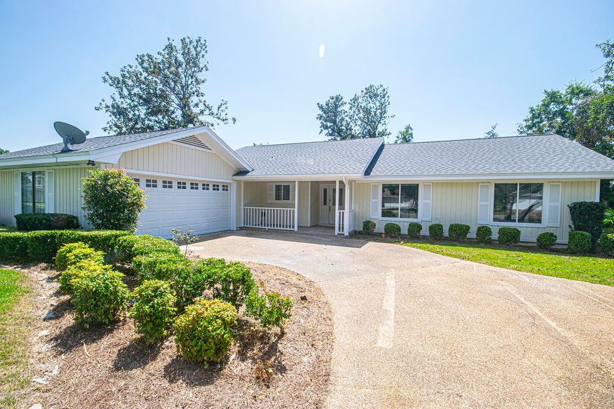 Come Discover 153 Marlin Circle in the much sought after community of Bay Point on PCB!  This home boasts 3 bedrooms, 2 bathrooms, to include; new roof, new granite counter tops and cabinets, all new luxury vinyl flooring, fresh paint exterior, interior including ceilings, new hot water heater  The master bathroom has a double vanity with separate shower and tub. Kitchen, family room and dining area are all open and together including a fireplace. The backyard features a larger paver-brick patio with fire pit, plenty of room for outdoor furniture and a grill also room for a pool or workshop and plenty of shade trees. Golf cart friendly community!  Make Offer today-price to reflect that some minor renovations are still needed, primarily in garage and bathroom fixtures.