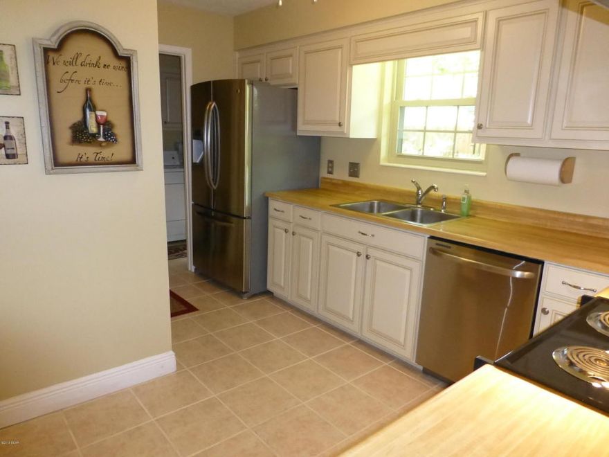 Pride in ownership shows! This 3 BR, 2 baths brick home in Venetian Villa is in excellent condition and ready for move in. This is a great home with a spacious living/dining  room, kitchen with breakfast bar and adjoining den with brick fireplace.  4 years ago this home was updated with refaced cabinets, new appliances, tile floor, in the kitchen and laundry room and wood laminate flooring in the living areas and the master bedroom, new French doors, new front door and ceiling fans, new windows, reinforced garage door, and vinyl sofits, fascia & trim. The roof was  replaced in May 2015, the interior was freshly painted in Jan and there is brand new carpet in 2 bedrooms. The lot is high and dry and the backyard is privacy fenced.