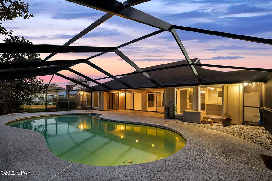 1 Back-up offer in place. - 

Bay Point Residence with an inground pool situated on 2 lots providing much greenery and privacy, this 4-bed, 3-bath home has marble floors throughout with many windows and sliding glass doors making it very light and bright. The kitchen has been renovated with shaker gray cabinets, granite countertops, stainless steel appliances, sink and dishwasher has a dedicated instant electric water heater plus an adjacent entertainment bar with an ice maker. Spacious foyer leads to a suite on either side, a large living room is found in the center of the home with a cathedral ceiling and fireplace. Master suite is decked out with a dressing area containing custom built-in cabinets, a walk-in closet and a separate shower and jetted soaker tub area. There's a second suite on the front right side of the house while the third and fourth bedroom share a jack-and-Jill bathroom. The home has a gas on demand water heater, 2 new HVAC systems with 2 Ecobee's thermostats. Convenient semi-circle driveway with carport and 3 separated storage lockouts. The 8ft Chlorine pool has a  screened enclosure and can be accessed from the Kitchen, living room and Master bedroom. Bay Point is a prestigious gated community in Panama City Beach Florida. All information is deemed correct, buyers should verify if they are important. Please note this is a double lot so there is an additional master association assessment for this property. $1,325 per lot = $2,650 per year.