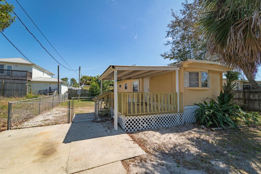 Beautifully refurbished mobile home only 1.5 blocks to Laguna Beach. If a condo is not quite your thing this home is a great option No hoa fees, fenced in yard, professionally decorated, new flooring ,new vanities, new countertops, freshly painted and it is sold furnished! All you need to bring is a swim suit. Laguna Beach is great! This area is more of a lifestyle than a location. It has its own Beachy vibe. Golf Cart to the locals' beach grocery store (The Carousel) or Thomas donuts for an ice cream, a burger or the well known Apple Fritter. Pier Park, 30A & Carillon Beach are a few of the hang outs that are close by. Awesome home! Awesome location!