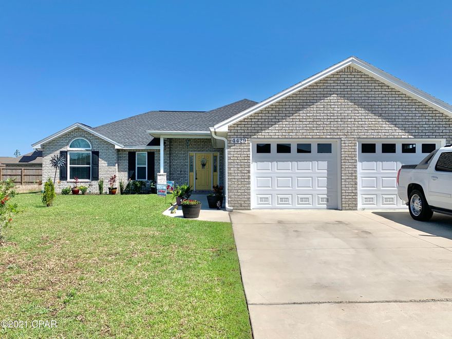 All brick 3/2 home with double garage. No HOA fee. This lovely home comes with a fireplace, ceramic tiles throughout main living areas (looks like hardwood), carpet in the bedrooms. Kitchen has granite countertops, upgraded appliances & custom wood cabinets. Master bedroom has trey ceiling with lighting,walk in closet, shower has rainmaker shower head and shower seat. Enclosed patio with large back yard. Home has security system with available monitoring.