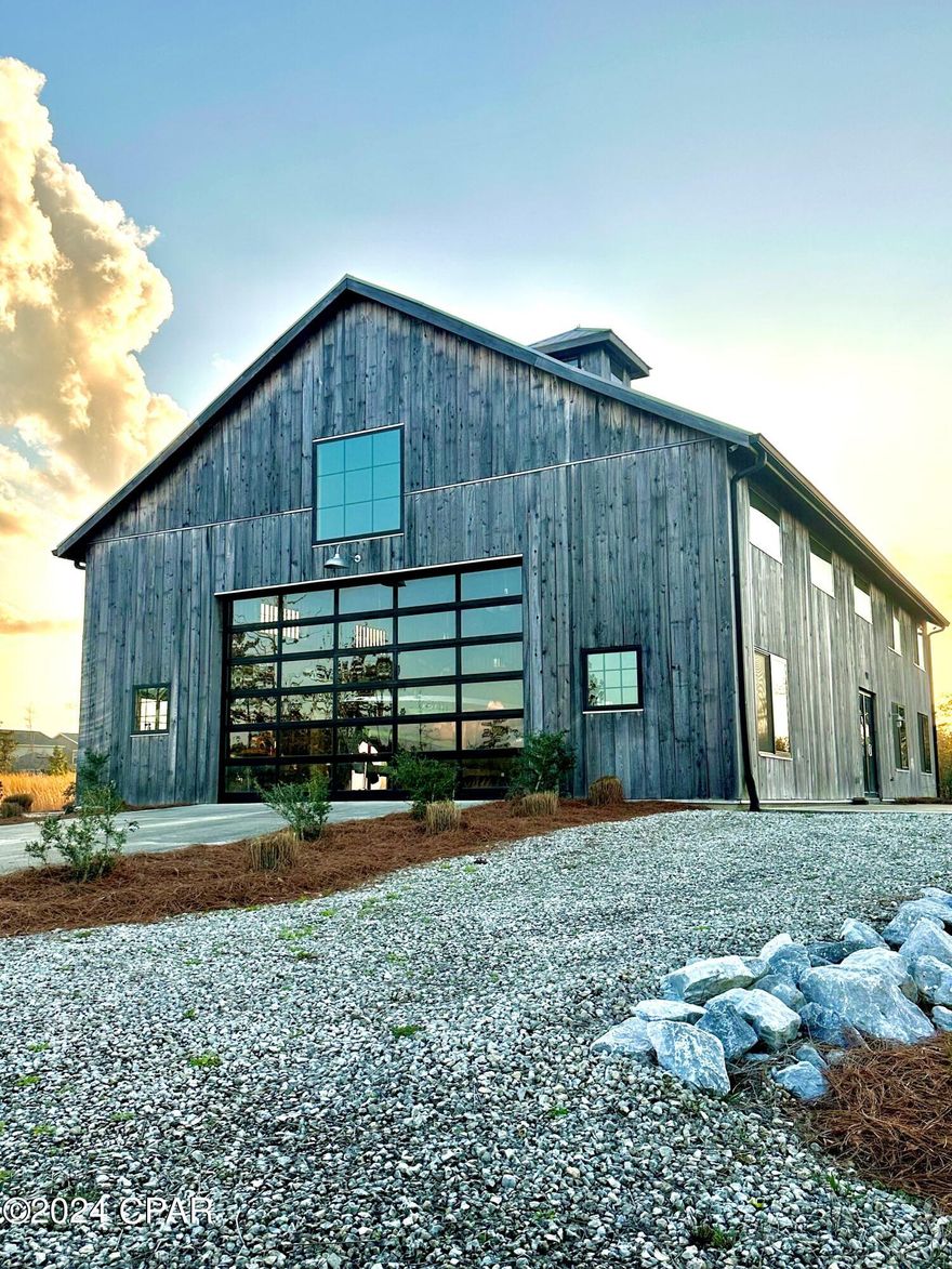 Discover the serene beauty of this approximately 2-acre waterfront property, offering the potential for
additional dock space. The charming cypress house, spanning approximately 3,920 square feet, features a cozy three-bedroom, one-bathroom apartment on the second floor and flexible living spaces on the first floor, including an office/bedroom and a kitchen rough-in. Enjoy the convenience of a separate
outdoor bathroom for the dock and the comfort of heating and cooling provided by an electronic fire station roll-up door. This property is part of the East Bay subdivision, with a limited number of remaining lots and designated RV/Boat storage. Nestled in Cook's Bayou, it boasts deepwater frontage on St.
Andrew's Bay, providing easy access to the Intracoastal Waterway and the Gulf of Mexico. Just a fifteen-minute drive away, you'll find Tyndall Air Force Base and various commercial amenities.