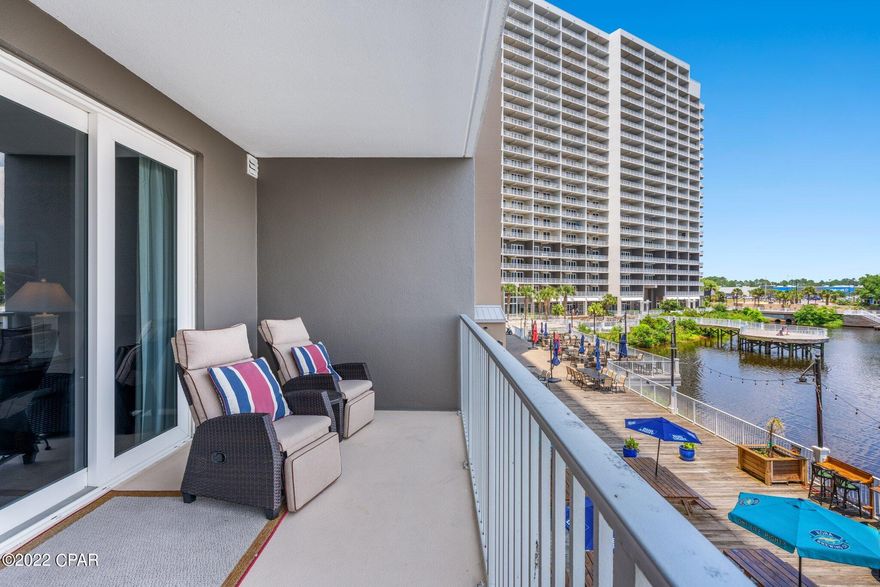 The northeast facing balcony of this well maintained 1 bedroom, 2 bathroom + bunk area condo at Laketown Wharf provides some of the best lake and fountain views in the entire building. Conveniently located on the first residential level extremely close to the staircase in the center of the building allowing for an easy option to skip the elevators. Projected short term rental annual income is over $36,000 per year. Enjoy resort-life with many shops on the ground level along with the 52,000 sqft. of lakefront Boardwalk and a nightly fountain & light show. Also the house of Juan Taco, the best taqueria in PCB! Reasonable HOA fees that includes water, sewer, cable/TV, pest control plus amenities such as gated beach access, 5 community pools (1 heated year-round), kids Playground, hot tubs, mini-golf, Splash Bar & Grill, fitness center with gulf views, 2 covered parking garages. All measurements and HOA Fees are deemed correct, buyers should verify if they are important.