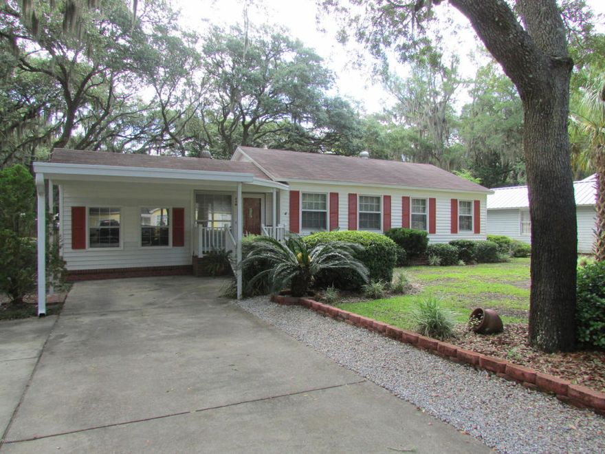 Amazing 3 bedroom 2 bath home in the heart of the Cove, which is rich with charm and tradition. This home is situated on a beautiful lot with lush landscaping, towering oak trees gently draped with Spanish moss providing welcome shade. Home as been completely remodeled the updates include kitchen and both bathrooms updated, freshly painted, stunning bamboo flooring, new fans and light fixtures, new A/C and ducts, plantation shutters, tankless gas hot water heater, and the addition of a screen room just mention a few. The living room and dining area are very spacious and enjoy an abundance of natural light. The cook in the family will love the kitchen which offers granite counter top, new cabinets, stainless appliances, new tile flooring, plenty of cabinet and counter space, an island