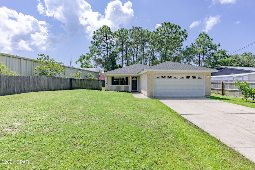 CURRENTLY UNDER CONTRACT, SELLER ACCEPTING BACKUP OFFERS. Back On Market due to buyers financing, nothing to do with home.  If you are looking for a move-in ready home, priced to sell, and recently updated, Roof 2021, AC 2018, Water Heater 2019, look no further, this home is for you! The living room is open to the eat-in kitchen, which comes complete with all appliances, and has direct access to the garage, as well as access to the side yard for added convenience. The master bedroom is at the end of the hall for privacy, with updated wood looking tile, its own master bath, and walk-in closet. The two additional bedrooms are to the right of the home and feature new laminate/wood flooring **No Carpet in this home**. The seller has converted from septic to city sewer, and have recently added gutters and a French drain system. The backyard is completely fenced and there is a concrete porch area that is fenced in separately, and has a Jacuzzi, which will stay with the home. You cannot beat this location. You are less than 1.5 miles to Pier Park with numerous areas to dine, shopping, entertainment, and if you like to walk, the home is reasonably within walking distance to the beach, and one street away from Scott Field Park, which has a great playground.  Additional Features include: Newly Painted, Wired for security system with panel in master bedroom, all 3 bedrooms have walk-in closets, Covered Farmers Porch, 2-Car garage with shelving. If this sounds like the property you have been waiting for Call Today Before Its Gone! Age, sq.ft., room dimensions, schools, taxes, lot size, or any important information is just an estimate and must be verified by the buyer via appraisal, formal or personal inspection if important.