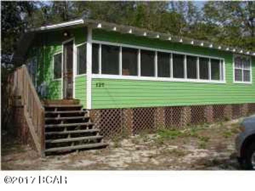 Well built Florida cottage moved to this high and dry lot in 2007.  All new plumbing and electric run at that time to the road.  Approximately 800 sq. ft with a large screened porch with original pine wood flooring in living area and kitchen.  New vinyl plank in remainder of the house.  New H/VAC installed in 2012.  Appliances include refrigerator, electric range less than 1 year old, and 2 yr old stackable washer dryer. Currently rents for $700/month. Lease is up August 1st. 24 Hr notice needed to show.