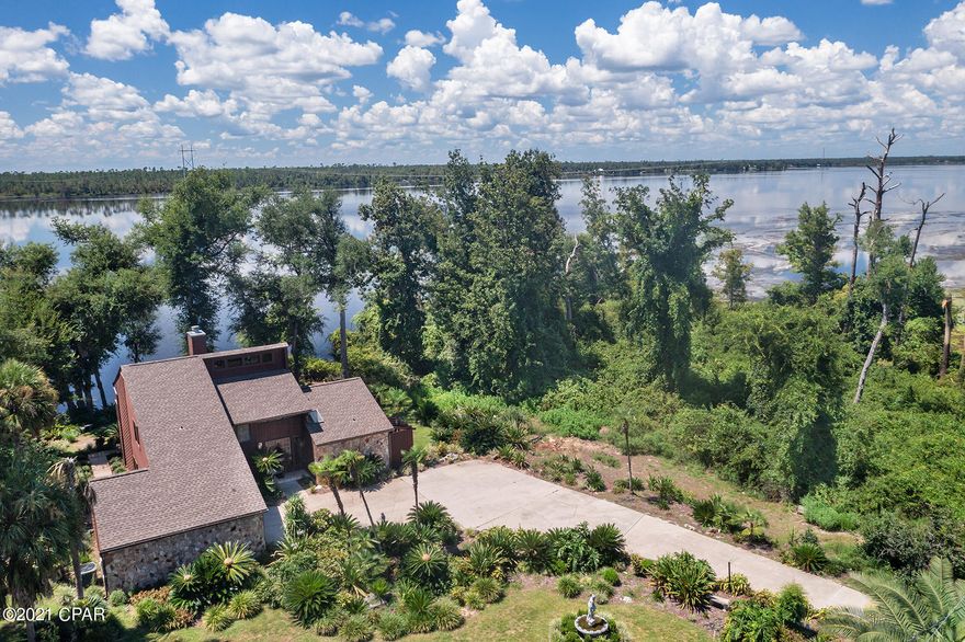 CURRENTLY UNDER CONTRACT SELLER ACCEPTING BACKUP OFFERS: Enjoy your morning cup of coffee surrounded by the serene beauty of Deerpoint Lake. With trees on the right side of the property, and mature palms throughout, you will feel secluded, yet you will be surprisingly close to every amenity anyone could want. This well maintained and meticulously kept home has All new wood decking with new gutters, new dry wall/paint, new AC Heat pump, and much more. Featuring an attached garage, an open upstairs floor plan for an amazing office/library area. The master suite is located downstairs and provides a breathtaking view of our beautiful lake. With 2 extra bedrooms upstairs, there is plenty of room for your family or guests. This exquisite home has a new roof, a new 4 ton Trane AC, n fresh water pump, new carpet throughout, new interior and exterior paint, and new light fixtures. It also has a built-in ADT security system. This home will prove to be a tranquil ending to your busy day as you sip on your evening beverage while breathing in the fresh lake air.