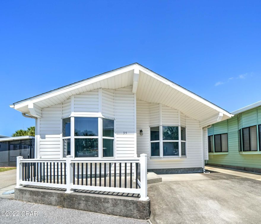 Rare opportunity to own in highly sought-after Venture Out. This beautiful 3 bedroom, 2 bath has a great open floor plan and flows beautifully! The kitchen is large and open to the living room. Seller has just added new paint, flooring, granite, backsplash and more. This home looks and feel like new! The location is premium as you have extra parking in the back of the home. Venture Out is a golf cart community that has exploded with popularity recently. With 300' on the beautiful pristine beaches of the Gulf of Mexico and 1,000' on the Gulf!