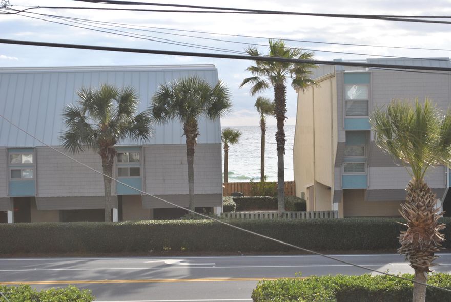 THE BEST LOCATION ....4 miles to 30A and 5 miles to Pier Park.  Great West End townhouse with gulf view. This home with 2 bedrooms. jack and jill bath upstairs and 1/2 bath downstairs has been updated and looks new. Enjoy that coffee in the morning and wine at night on your deck looking at the gulf. Public beach walkover within steps of home. Outside storage for beach toys, etc.  This is not a condo...you own the land..not air.  It just doesn't get any better than this.  All furnishings remain except the items listed on the bar.  Usually vacant so a really easy show.