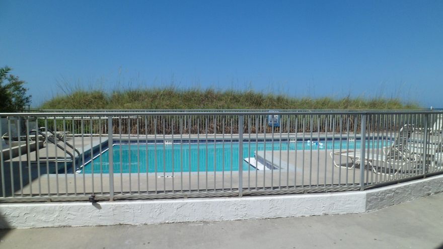 Right in the heart of Front Beach Road these units are waterfront, just steps away from the World's most beautiful beaches. Completely renovated 2 story unit.  2 master bedrooms downstairs and a loft with bed upstairs.. you will be amazed at the redecorating and will be proud to show this unit. ambassador is located just a few blocks from pier park and will make a wonderful rental for those wanting beachfront exposure without the high price..owner financing available.