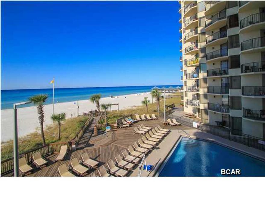 Great investment opportunity at Sunbird in Panama City Beach. Ideally located adjacent to Pineapple Willy's and less than 15 minutes away from Pier Park, Miracle Strip Amusement Park, and Saint Andrews State Park. This turn-key rental ready unit features a fully appointed kitchen complete with granite countertops and breakfast bar, tile floors throughout, great views of the Gulf, and strong rental history. This unit overlooks one of the community's 2 Gulf front pools and is only steps away from private beach access. Floor-to-ceiling glass windows and a sliding glass door access to the balcony make gulf views visible from the kitchen and living/dining area, or step out onto your private balcony to witness breathtaking sunsets over the Gulf.
