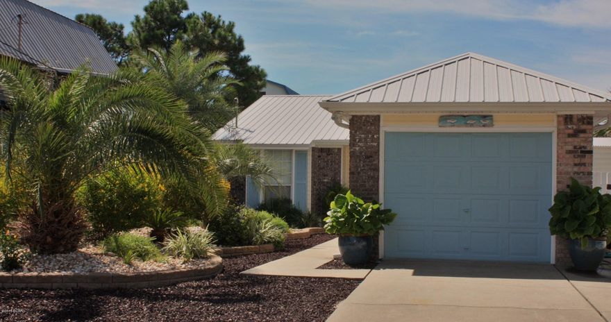 If you have dreamed of owning a true beach house - this is it!  zero maintenance yard - lush tropical landscaping.  Extremely well maintained and plenty of upgrades.  New flooring, new roof, awesome kitchen - you will LOVE the beach décor - and this house is sold Furnished!  move in immediately, or start renting.  just a bike ride to beach access!  The back yard is a vacation paradise.  PLUS a really nice work shed!