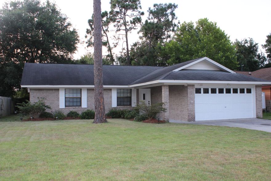 Gorgeous 3 bedroom, 2 bath home located close to schools, shopping, restaurants and Tyndall AFB. This solid brick home has been lovingly cared for by the current owner.  Many upgrades have been done such as wood floors, granite counters, new vanities in both bathrooms and fresh paint, just to name a few.  The interior of the home has beamed ceilings and a corner fireplace as well as a formal dining area just off of the kitchen.  All 3 bedrooms are quite large, with the master bedroom featuring a walk in closet and master bath suite.  The kitchen is bright and fresh and features a generous appliance package.  The exterior of the home is maintenance free brick.  A two car garage takes care of car storage.  Come see this beautiful home today!!!!