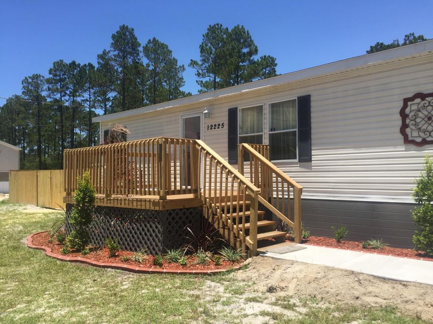 PERFECT LOCATION FOR EASTERN SHIPBUILDING Virtually brand new home!  Freshly painted, new plush carpet, door knobs, floor vents, smoke detectors and lighting- all new.  Black appliances are like new with side by side refrigerator w ice and water, glass stove top and a big pantry. Custom window treatments, Master bath has a separate corner tub and standing shower with sliding doors. New deep well-320ft, septic tank emptied and filter cleaned and new pump to lift station. New 6ft  privacy fence, new grass in back, new concrete driveway with parking for 2 cars and a drainage grate, new front 10x12 deck with landscaping and new back 15x20 screened porch.  New AC coil.  All new plumbing thru out home with new faucets.  New 6x8 all weather shed on a concrete patio. 

MOVE IN READY