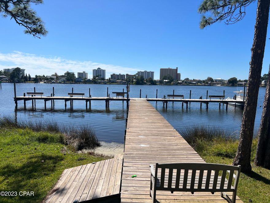 This 2 Br 2 Ba is a diamond in the rough! The unit has a view of the Lagoon plus a large nature area outside your screened porch. The unit is a ground floor unit and includes a covered parking space. The complex has a pool and boat dock. Palisades is centrally located near the schools, shopping and attractions Panama City Beach has to offer!