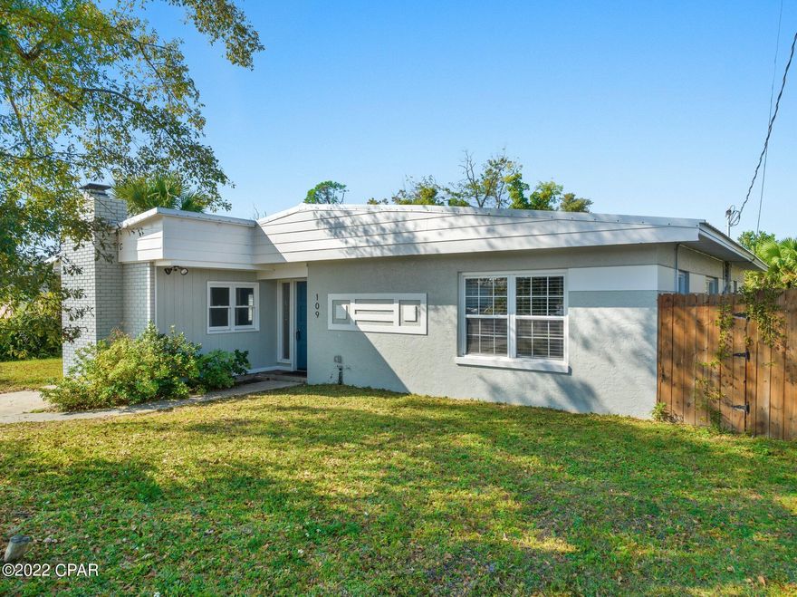 Under contract - seller will consider back up offers. This adorable Cove cottage with three bedrooms and one and a half baths would be a wonderful first home or rental, long term or short term.  There are two separate sitting areas as well as a dining area. The kitchen is open to the living areas and has a refrigerator and dishwasher. There is a large, separate laundry room with a washer and dryer. The roof was replace in 2019 and the seller has added a half bath.  The back yard is fully fenced and has a small storage shed. This home is conveniently located near all that downtown Panama City has to offer and a short ride to the world's most beautiful beaches. Call your Realtor today for your personal tour.