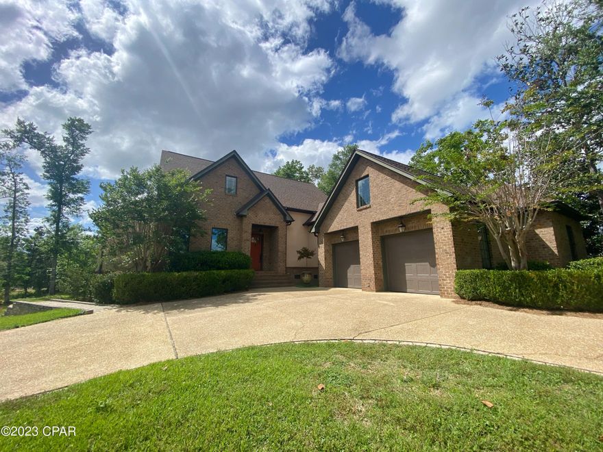 Absolutely Beautiful custom home located in desirable WATSON HEIGHTS subdivision in the heart of Marianna, FL. This 3 bedroom, designed from a Southern Living Plan, was built with characteristics of historic homes with 10 ft ceilings on the first floor, dramatic 8 ft tall custom doors, & hardwood floors throughout! You'll love the downstairs master suite w/ his & her closet space, double vanities, separate shower & garden tub. The office is just off the master (could possibly be used as a 4th bedroom, but currently no closet). Large cased door frames help create an open feel to the living spaces with a beautiful Florida room overlooking the large back deck.  Kitchen open to dining area with large pantry, lots of cabinets with pull-out drawers and modern appliances including a gas stove.   A large laundry area with desk area, sink and cabinets for storage.  Upstairs 2 more bedrooms have private baths & a spacious living area between. Over the oversized 2 car garage, you'll find the bonus room complete w/ hardwood flooring & mini split HVAC unit.  A spacious basement area offers a workshop and lots of storage. New roof in 2019