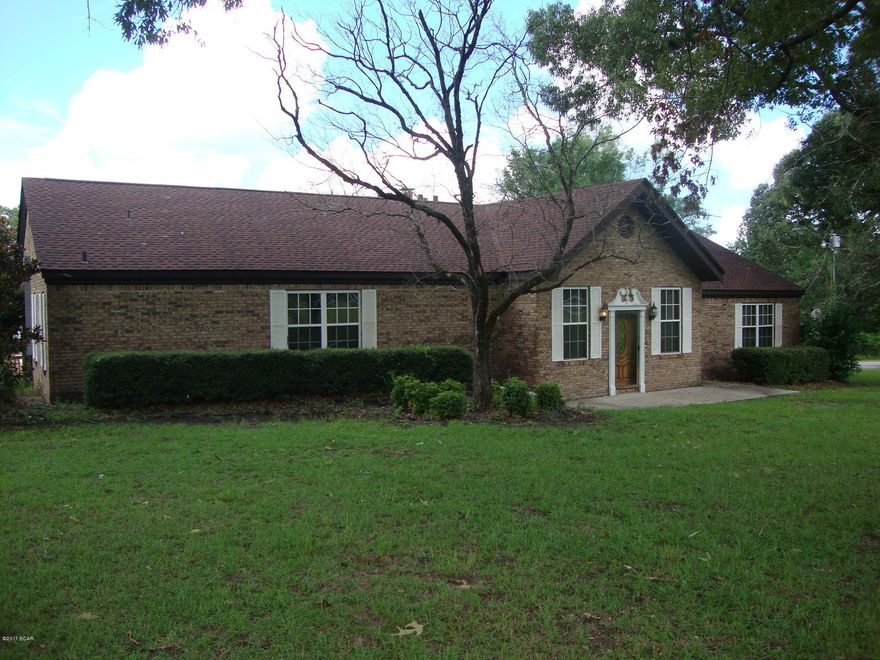 Close to town and on paved road. 21+ Acres and Huge Custom Built Brick Home. Over 2900 sq. ft. of living space. New shingle roof. 4 Bedroom and 3 Bathrooms, Nice Formal living room;Den with brick fireplace with insert, beamed cathedral ceilings; Large Kitchen/Dining Room with good sized pantry, Jenn-Air

Stovetop and instant hot-water; 2 master bedrooms with huge master baths and one has whirlpool tub. Insulated windows and extra insulation in the ceiling. Large Laundry room with cabinets and shelving. Intercom system and security system. 2 heating and cooling systems and 2 hotwater heaters. Nice covered back porch with carpet and columns. Floored area in the attic for storage. 18 X 36 enclosed inground swimming pool with about 2000 sq. ft. deck. Huge metal barn with concrete floor, 220 electric and built in storage and workbenches. Pump house with lean-too on each side for yard equipment. Over 1/2 acre nice fish pond with catfish, bass, brim and shellcracker. Lights ad water lines at the pond makes it convenient for cleaning those fish. Land is mostly cleared. Frontage on paved road and not far from town. Lots and Lots of extras. According to new surveyor some of the fencing and cross fencing is not on the property.