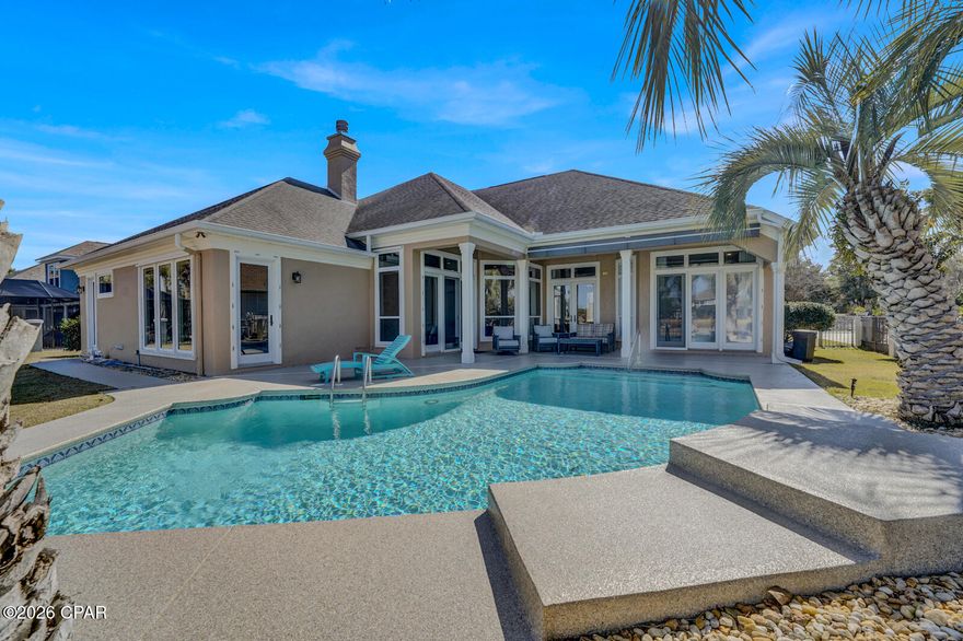 This stunning Panama City Beach residence on the prestigious Legend Hill side of Bay Point offers an unparalleled lifestyle overlooking the Nicklaus course 10th green and 11th tee box. The exterior was painted in Oct. of 2023. The meticulously updated interior features fresh paint, newly refinished hardwood floors, and plush new bedroom carpeting, all framed by soaring 10-14' ceilings, elegant crown molding, and the windows have motorized blinds for ease of comfort. Plenty of room for a 4th bedroom by converting office. Designed for both comfort and entertainment, the home boasts a gourmet kitchen with granite countertops and new stainless-steel appliances, a cozy gas fireplace with a convenient built-in bar, and a rare 3-car garage. The master bedroom is very large and offers plenty of room for a sitting area. The master bath was recently renovated with large shower and soaking tub, combined in a wet room, new vanity, flooring, and a separate toilet room. The home has 2 HVAC systems; one replaced in 2022. The water heater was replaced in 2024. Home also features a water filtration system, surround sound, and security system setup. Step outside to your private oasis, where you will find a freshly coasted pool deck, heated pool, covered patio, and fenced-in yard provide a serene vantage point for breathtaking pond and fairway views on one of the community's premier homesites. All measurements are approx and should be verified by buyer.